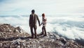 Couple Man and Woman walking in mountains