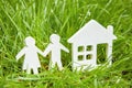 Couple man and woman young family near home dream on green grass. Construction of a house from environmentally friendly materials. Royalty Free Stock Photo