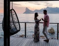 couple man and women watching sunset on the balcony during vacation in Cape Town South Africa Royalty Free Stock Photo