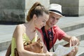 couple with map sitting on step Royalty Free Stock Photo