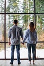 Couple or marriage in his new home looking through the window Royalty Free Stock Photo