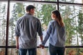 Couple or marriage in his new home looking through the window