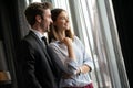 Couple or marriage in his new home looking through the window Royalty Free Stock Photo