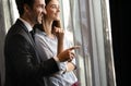 Couple or marriage in his new home looking through the window Royalty Free Stock Photo