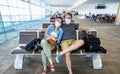 Couple with mask stuck in airport no able to return home country due to COVID-19 border closures