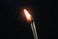 Couple of matches burning together with heat flame isolated on a black background. Royalty Free Stock Photo