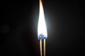 Couple of matches burning together with heat flame isolated on a black background Royalty Free Stock Photo