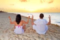 Couple meditating together on the Caribbean Sea Royalty Free Stock Photo