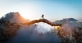 Couple meet halfway on mountain bridge. Love and reunion