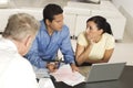 Couple In Meeting With Advisor Royalty Free Stock Photo