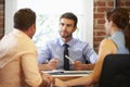 Couple Meeting With Financial Advisor In Office Royalty Free Stock Photo