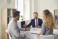 Couple meeting with insurance broker, bank manager, real estate agent or mortgage advisor Royalty Free Stock Photo