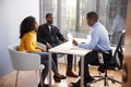 Couple Meeting With Male Financial Advisor Relationship Counsellor In Office Royalty Free Stock Photo