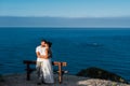 Couple in love at dawn by the sea