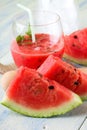 Couple of melon slices in front of fruit smoothie Royalty Free Stock Photo