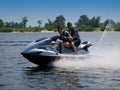 Couple men on jet ski in the river Royalty Free Stock Photo