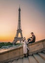 couple men an woman honeymoon Paris Eiffel tower sunrise, couple men and woman city trip in Paris Royalty Free Stock Photo