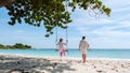 A couple of men and woman at a swing on the beach of Koh Samet Island Rayong Thailand Royalty Free Stock Photo