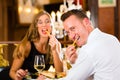 Happy couple in restaurant eat fast food Royalty Free Stock Photo