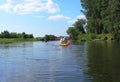 A couple of men and women kayak on the river in the summer. Active recreation, family travel, extreme adventure, sports and