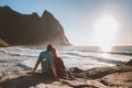 Couple man and woman in love relaxing on Kvalvika beach