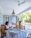 couple man and woman mid age having breakfast on their balcony of an appartment luxury hotel condo in Mauritius Royalty Free Stock Photo