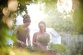 Couple, man and woman with plants in backyard, harvest and sustainability of herbs for growth. Happy people, working and Royalty Free Stock Photo