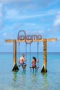 Couple at a swing in the ocean of Curacao Caribbean Island, Kokomo Beach Curacao Royalty Free Stock Photo