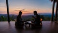 a couple of men and women on vacation in Northern Thailand staying at a homestay cabin hut