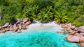 couple men and women vacation at the Seychelles visiting the tropical beach of Anse Lazio Royalty Free Stock Photo