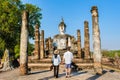 Couple visit Wat Mahathat, Sukhothai old city, Thailand., Sukothai historical park Thailand