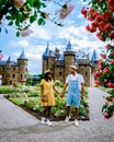 Couple men and women visiting Castle de Haar Utrecht, view of De Haar Castle in Utrecht Netherlands