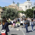 Couple of mexican tourists taking pictures in the streets of Rome, near Piazza Venezia. Rom