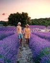 Couple mid age men and woman on vacation in the Provence visiting the blooming lavender fields in France