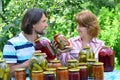 Couple of middle age with homemade preserves and jams Royalty Free Stock Photo