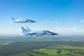 Couple military jet fighter aircraft, flying above ground Royalty Free Stock Photo