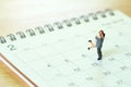 Couple Miniature 2 people standing on Calendar. Day 14 meets Val