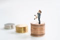 Couple Miniature 2 people standing on stack of coins to thinking