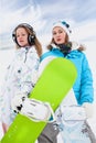 Couple modern fun snowborder girls