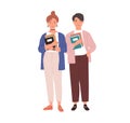 Couple of modern students with books in hands. Young man and woman holding textbooks. Portrait of teenagers standing Royalty Free Stock Photo