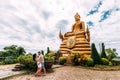 Guy and girl at the monument to the Buddha