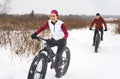 Couple Mountain Biking on Fat Bikes in the winter