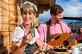 Couple on mountain hut eating Kaiserschmarrn