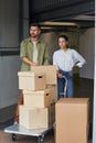 Couple Moving Boxes in Storage Unit Royalty Free Stock Photo