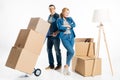 Couple moving cardboard boxes on hand cart Royalty Free Stock Photo