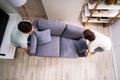 Couple Moving And Carrying Sofa Furniture Royalty Free Stock Photo