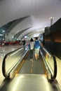 Couple moving at escalator Indore Dubai international Airport