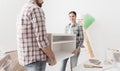 Couple moving furnishings in their new house Royalty Free Stock Photo