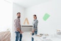 Couple moving furnishings in their new house Royalty Free Stock Photo