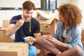 Couple Moving Into New Home Enjoying Takeaway Meal Royalty Free Stock Photo